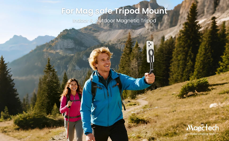 Two hikers in a mountainous area with a magnetic tripod mount displayed.
