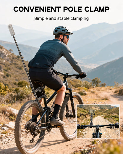 Man riding a bicycle using a Maectech adjustable bike camera mount pole clamp on a mountain trail.